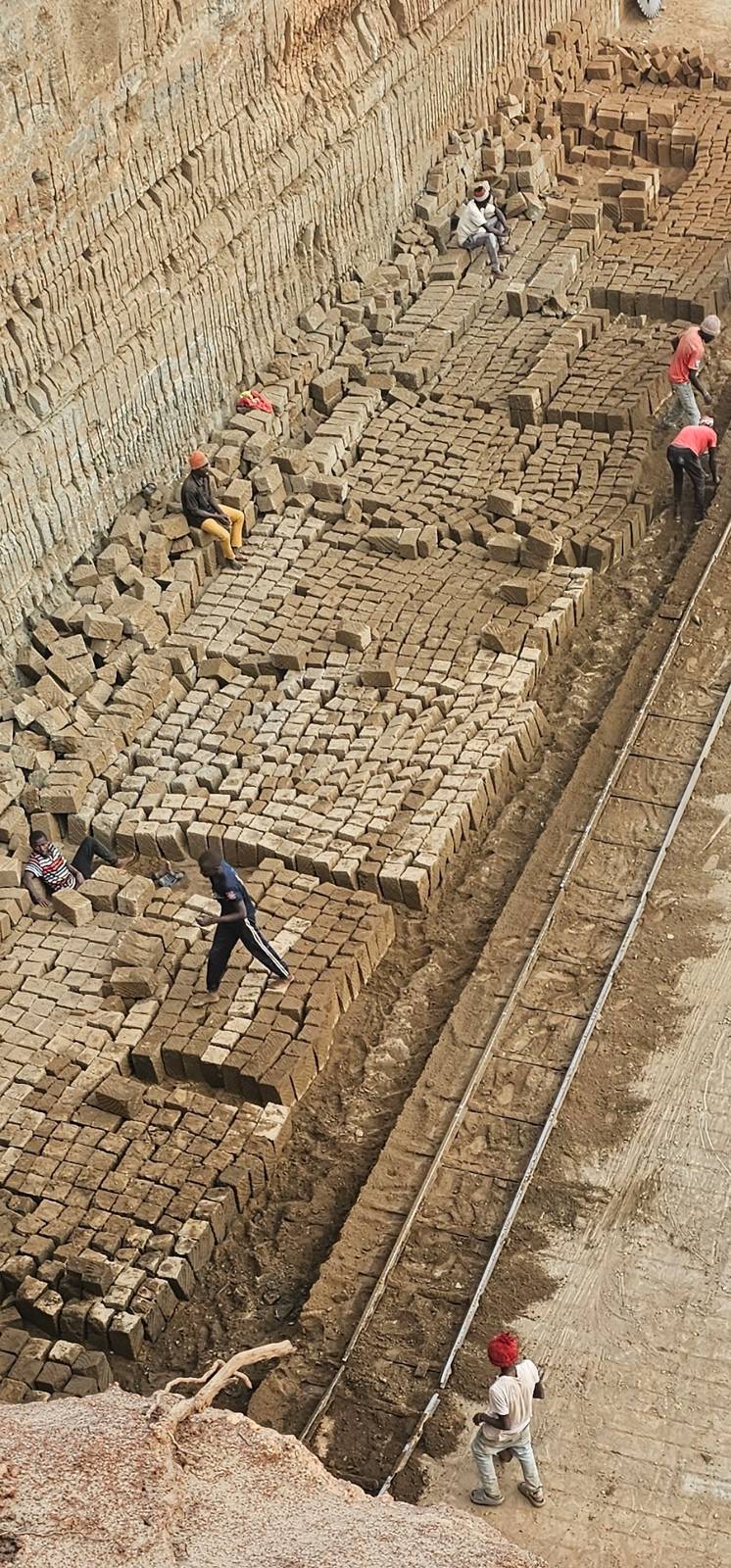 Aerial view of the quarry floor with rows of freshly cut Ndarugo stone